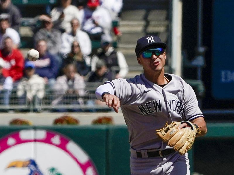 Apr 26, 2023; Minneapolis, Minnesota, USA; New York Yankees infielder Anthony Volpe (11) throws to first for a force out against the Minnesota Twins at Target Field. Mandatory Credit: Nick Wosika-USA TODAY Sports

