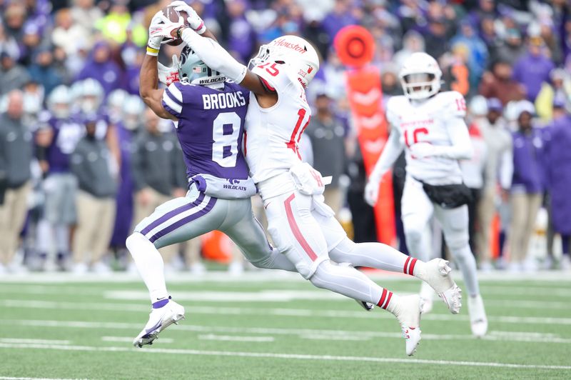 Oct 28, 2023; Manhattan, Kansas, USA; Kansas State Wildcats wide receiver Phillip Brooks (8) makes a catch against Houston Cougars defensive back Malik Fleming (15) during the second quarter at Bill Snyder Family Football Stadium. Mandatory Credit: Scott Sewell-USA TODAY Sports