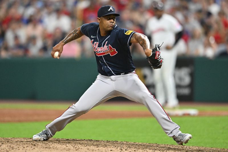 Jul 3, 2023; Cleveland, Ohio, USA; Atlanta Braves relief pitcher Raisel Iglesias (26) throws a pitch during the ninth inning against the Cleveland Guardians at Progressive Field. Mandatory Credit: Ken Blaze-USA TODAY Sports