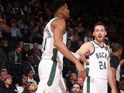 NEW YORK, NY - DECEMBER 23:  Pat Connaughton #24 of the Milwaukee Bucks & Giannis Antetokounmpo #34 of the Milwaukee Bucks high five during the game  on December 23, 2023 at Madison Square Garden in New York City, New York.  NOTE TO USER: User expressly acknowledges and agrees that, by downloading and or using this photograph, User is consenting to the terms and conditions of the Getty Images License Agreement. Mandatory Copyright Notice: Copyright 2023 NBAE  (Photo by Nathaniel S. Butler/NBAE via Getty Images)