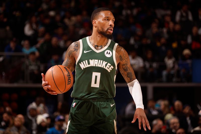 DETROIT, MI - JANUARY 22: Damian Lillard #0 of the Milwaukee Bucks looks on during the game against the Detroit Pistons  on January 22, 2024 at Little Caesars Arena in Detroit, Michigan. NOTE TO USER: User expressly acknowledges and agrees that, by downloading and/or using this photograph, User is consenting to the terms and conditions of the Getty Images License Agreement. Mandatory Copyright Notice: Copyright 2024 NBAE (Photo by Brian Sevald/NBAE via Getty Images)