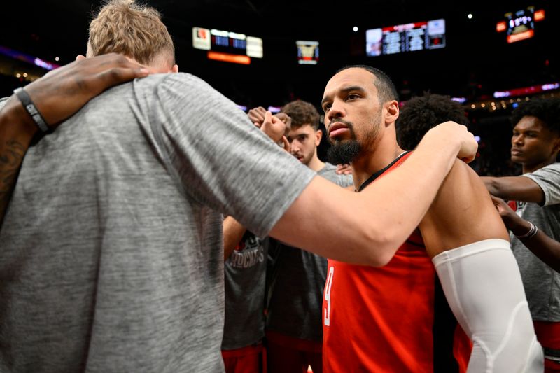 PORTLAND, OREGON - MARCH 08: Dillon Brooks #9 of the Houston Rockets huddles with his team before the game against the Portland Trail Blazers at the Moda Center on March 08, 2024 in Portland, Oregon. NOTE TO USER: User expressly acknowledges and agrees that, by downloading and or using this photograph, User is consenting to the terms and conditions of the Getty Images License Agreement. (Photo by Alika Jenner/Getty Images)