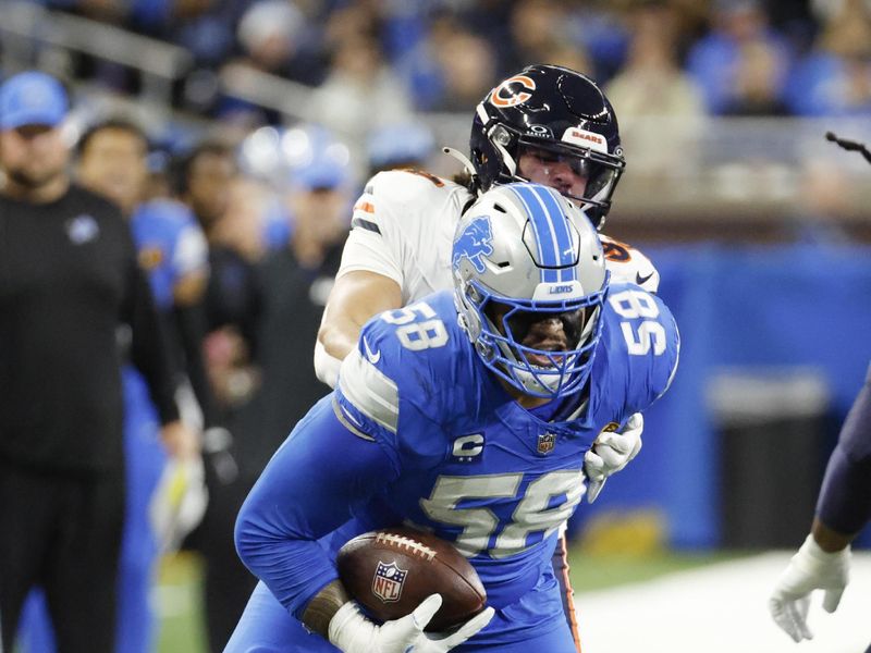 Detroit Lions offensive tackle Penei Sewell (58) runs the ball against the Chicago Bears in the first half of an NFL football game in Detroit, Thursday, Nov. 28, 2024. (AP Photo/Rick Osentoski)