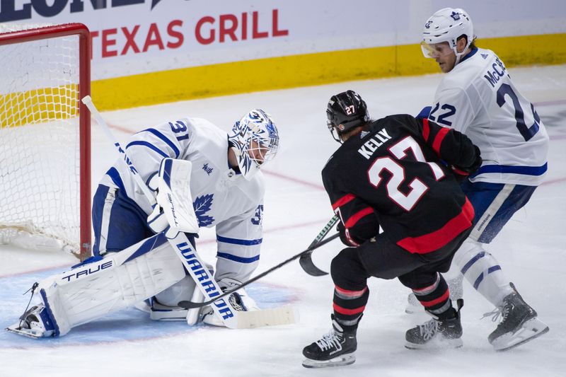 Feb 10, 2024; Ottawa, Ontario, CAN; Toronto Maple Leafs goalie Martin Jones (31) makes a save in front of Ottawa Senators left wing Parker Kelly (27) in the third period at the Canadian Tire Centre. Mandatory Credit: Marc DesRosiers-USA TODAY Sports