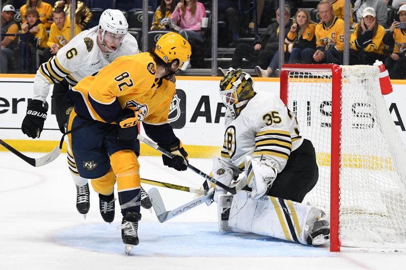 Apr 2, 2024; Nashville, Tennessee, USA; Boston Bruins goaltender Linus Ullmark (35) makes a save on a shot by Nashville Predators center Tommy Novak (82) during the third period at Bridgestone Arena. Mandatory Credit: Christopher Hanewinckel-USA TODAY Sports