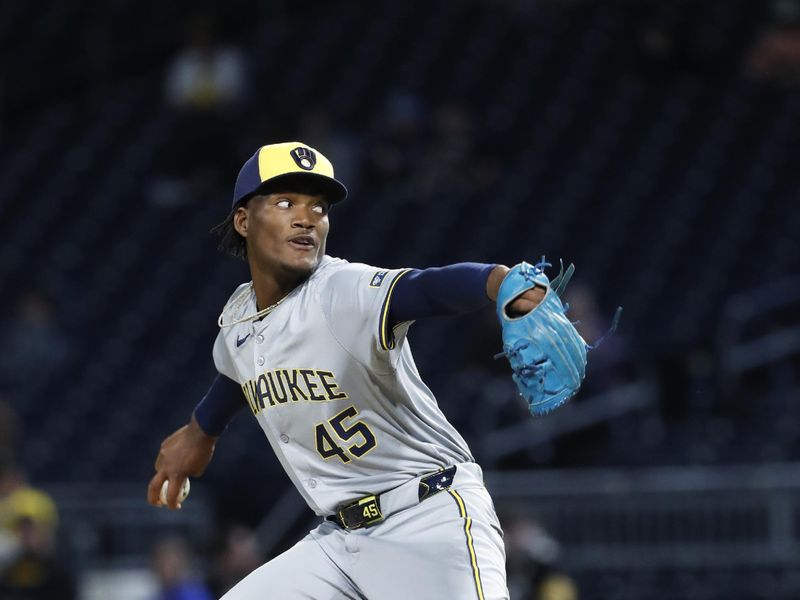 Apr 23, 2024; Pittsburgh, Pennsylvania, USA;  Milwaukee Brewers relief pitcher Abner Uribe (45) pitches against the Pittsburgh Pirates during the eighth inning at PNC Park.  Mandatory Credit: Charles LeClaire-USA TODAY Sports