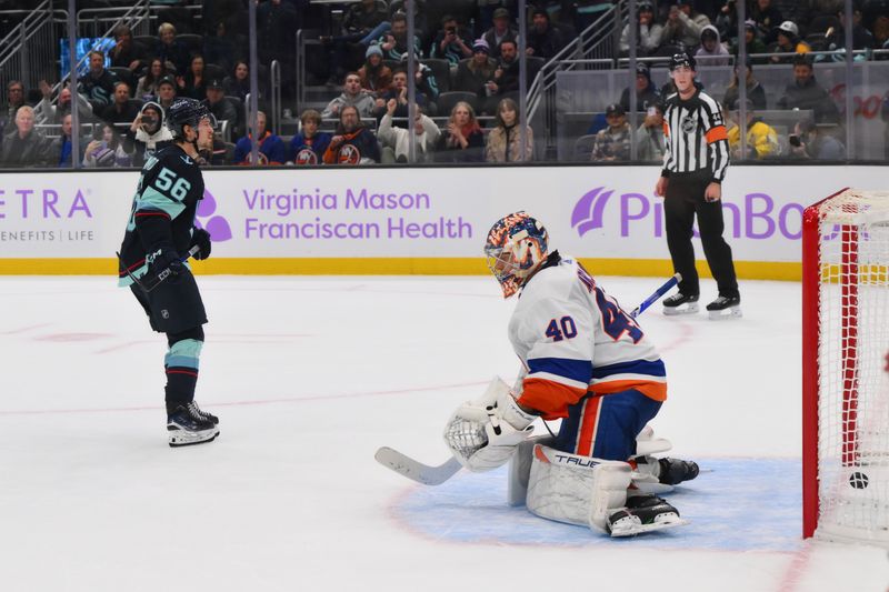 Nov 16, 2023; Seattle, Washington, USA; Seattle Kraken right wing Kailer Yamamoto (56) scores a shootout goal New York Islanders goaltender Semyon Varlamov (40) at Climate Pledge Arena. Mandatory Credit: Steven Bisig-USA TODAY Sports