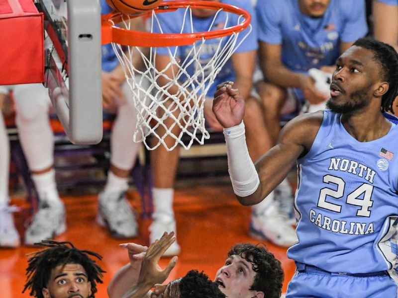 Jan 6, 2024; Clemson, South Carolina, USA; Clemson junior forward PJ Hall (24) scores near University of North Carolina forward Jae'Lyn Withers (24) during the first half  at Littlejohn Coliseum. Mandatory Credit: Ken Ruinard-USA TODAY Sports