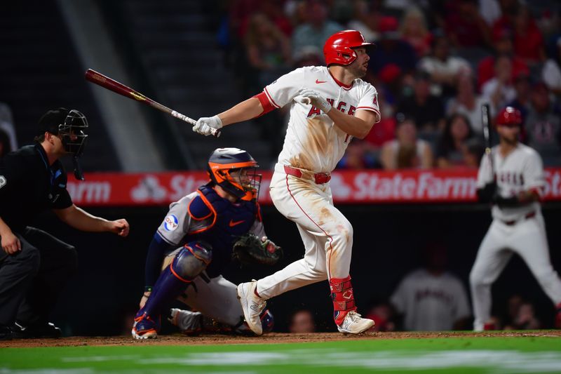 Sep 13, 2024; Anaheim, California, USA; Los Angeles Angels first baseman Nolan Schanuel (18) hits an RBI double against the Houston Astros during the third inning at Angel Stadium. Mandatory Credit: Gary A. Vasquez-Imagn Images