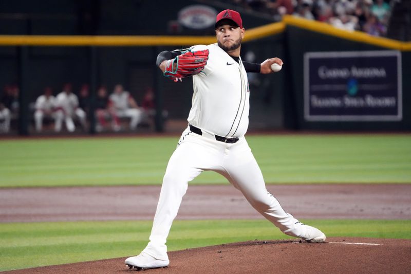 Sep 13, 2024; Phoenix, Arizona, USA; Arizona Diamondbacks pitcher Eduardo Rodriguez (57) pitches against the Milwaukee Brewers during the first inning at Chase Field. Mandatory Credit: Joe Camporeale-Imagn Images