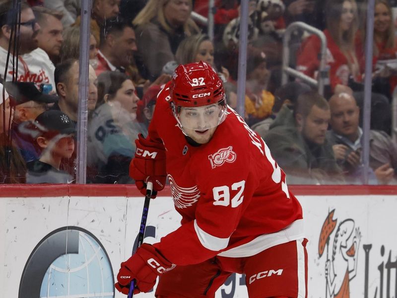 Nov 18, 2025; Detroit, Michigan, USA; Detroit Red Wings center Marco Kasper (92) plays the puck in the second period against the Seattle Kraken at Little Caesars Arena. Mandatory Credit: Rick Osentoski-Imagn Images