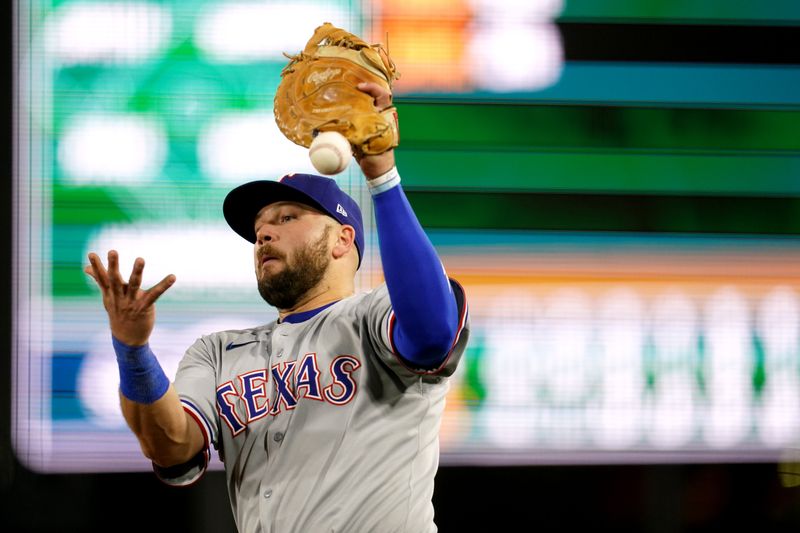 Apr 23, 2025; West Sacramento, California, USA; Texas Rangers first baseman Jake Burger (21) drops a fly ball in foul territory against the Athletics in the eighth inning at Sutter Health Park. Mandatory Credit: Cary Edmondson-Imagn Images