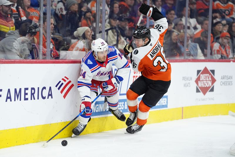 Jan 17, 2026; Philadelphia, Pennsylvania, USA; New York Rangers right wing Taylor Raddysh (14) and Philadelphia Flyers defenseman Emil Andrae (36) battle for the puck in the first period at Xfinity Mobile Arena. Mandatory Credit: Kyle Ross-Imagn Images