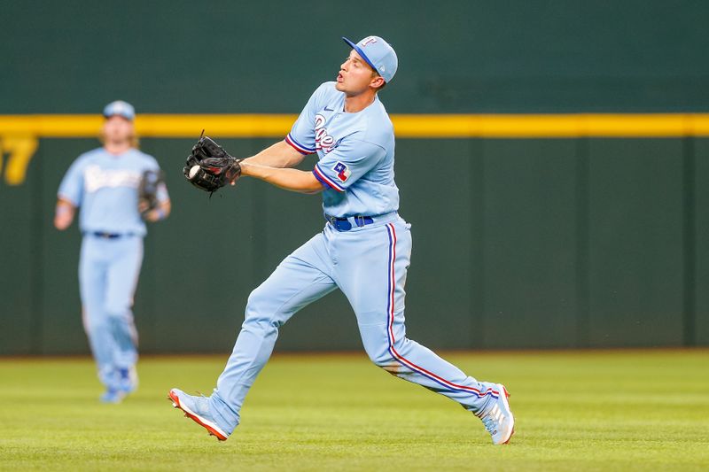 Apr 2, 2023; Arlington, Texas, USA; Texas Rangers shortstop Corey Seager (5) catches the ball during the eighth inning against the Philadelphia Phillies at Globe Life Field. Mandatory Credit: Andrew Dieb-USA TODAY Sports