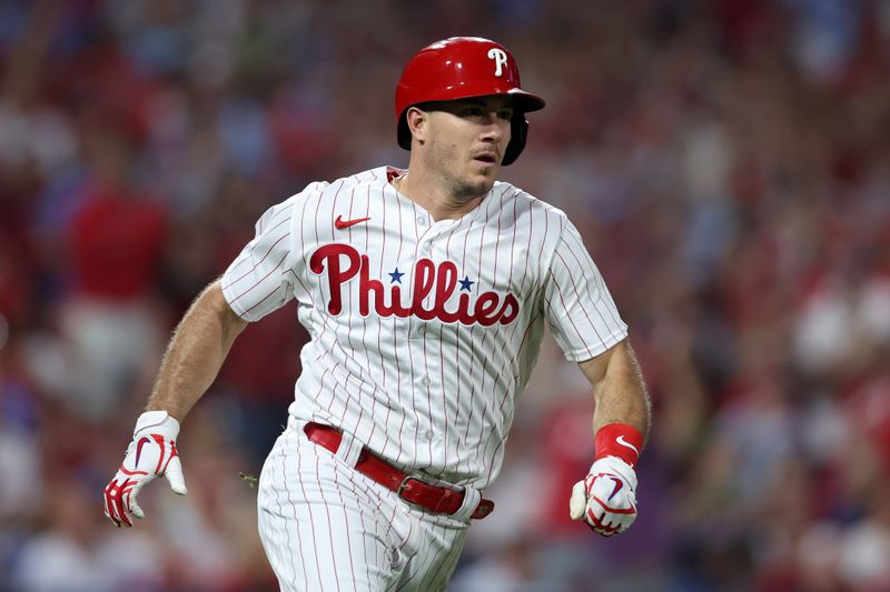 Oct 4, 2023; Philadelphia, Pennsylvania, USA; Philadelphia Phillies catcher J.T. Realmuto (10) runs the bases after hitting a double against the Miami Marlins during the second inning for game two of the Wildcard series for the 2023 MLB playoffs at Citizens Bank Park. Mandatory Credit: Bill Streicher-USA TODAY Sports