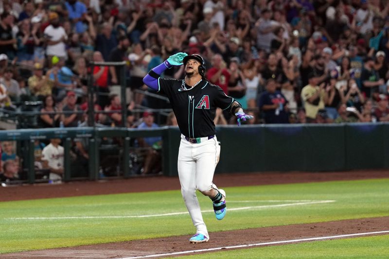 Jul 27, 2024; Phoenix, Arizona, USA; Arizona Diamondbacks second base Ketel Marte (4) runs the bases after hitting a two run home run against the Pittsburgh Pirates during the second inning at Chase Field. Mandatory Credit: Joe Camporeale-USA TODAY Sports