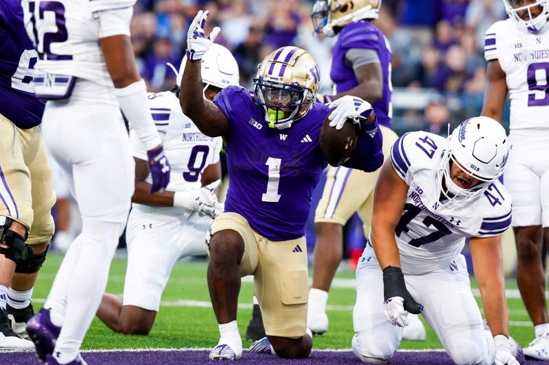 Sep 21, 2024; Seattle, Washington, USA; Washington Huskies running back Jonah Coleman (1) celebrates after rushing for a touchdown against Northwestern Wildcats defensive lineman Michael Kilbane (47) during the fourth quarter at Alaska Airlines Field at Husky Stadium. Mandatory Credit: Joe Nicholson-Imagn Images