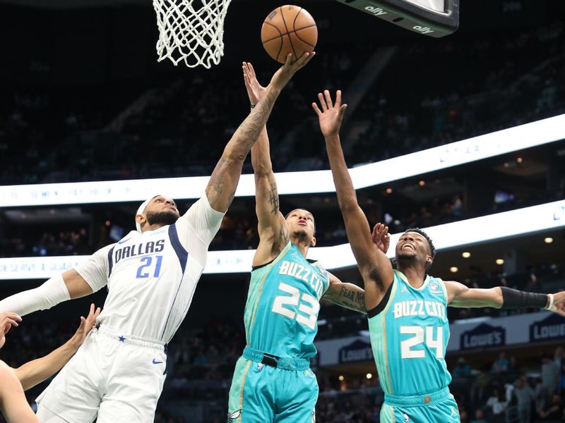 CHARLOTTE, NC - APRIL 9: Players go up for a rebound during the game on April 9, 2024 at Spectrum Center in Charlotte, North Carolina. NOTE TO USER: User expressly acknowledges and agrees that, by downloading and or using this photograph, User is consenting to the terms and conditions of the Getty Images License Agreement. Mandatory Copyright Notice: Copyright 2024 NBAE (Photo by Brock Williams-Smith/NBAE via Getty Images)