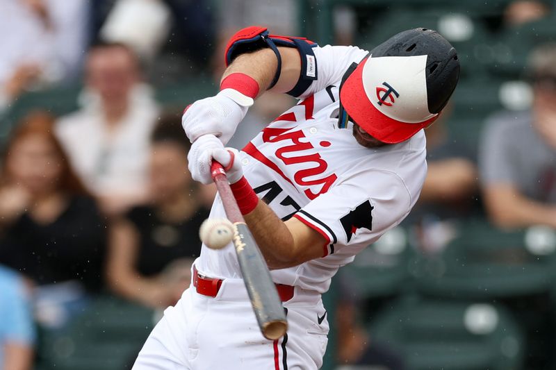 Mar 6, 2024; Fort Myers, Florida, USA;  Minnesota Twins second baseman Edouard Julien (47) hits a three-run home run against the Boston Red Sox in the third inning at Hammond Stadium. Mandatory Credit: Nathan Ray Seebeck-USA TODAY Sports