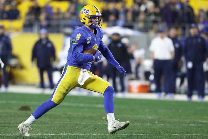 Nov 14, 2019; Pittsburgh, PA, USA;  Pittsburgh Panthers quarterback Kenny Pickett (8) runs the ball against the North Carolina Tar Heels during the second quarter at Heinz Field. Mandatory Credit: Charles LeClaire-USA TODAY Sports