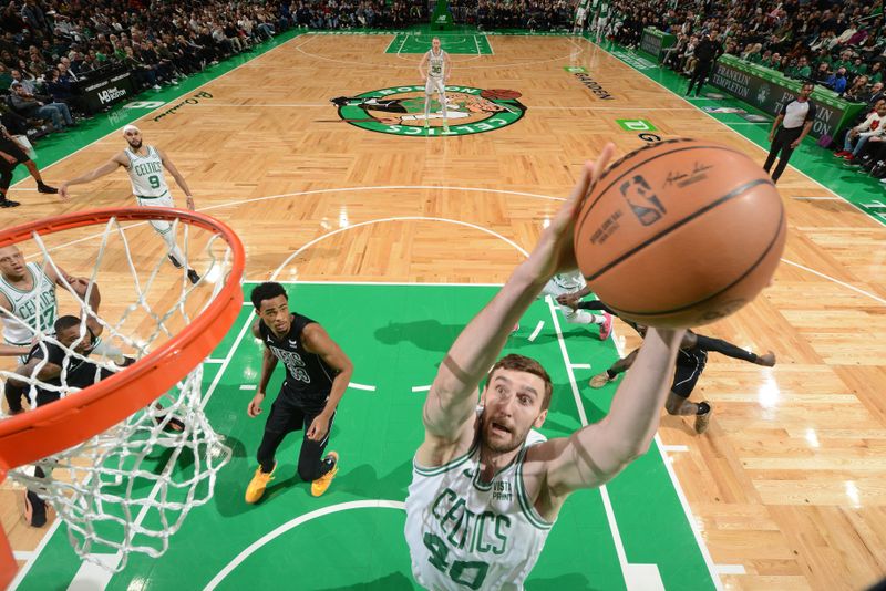 BOSTON, MA - FEBRUARY 14: Luke Kornet #40 of the Boston Celtics grabs a rebound during the game against the Brooklyn Nets on February 14, 2024 at the TD Garden in Boston, Massachusetts. NOTE TO USER: User expressly acknowledges and agrees that, by downloading and or using this photograph, User is consenting to the terms and conditions of the Getty Images License Agreement. Mandatory Copyright Notice: Copyright 2024 NBAE  (Photo by Brian Babineau/NBAE via Getty Images)