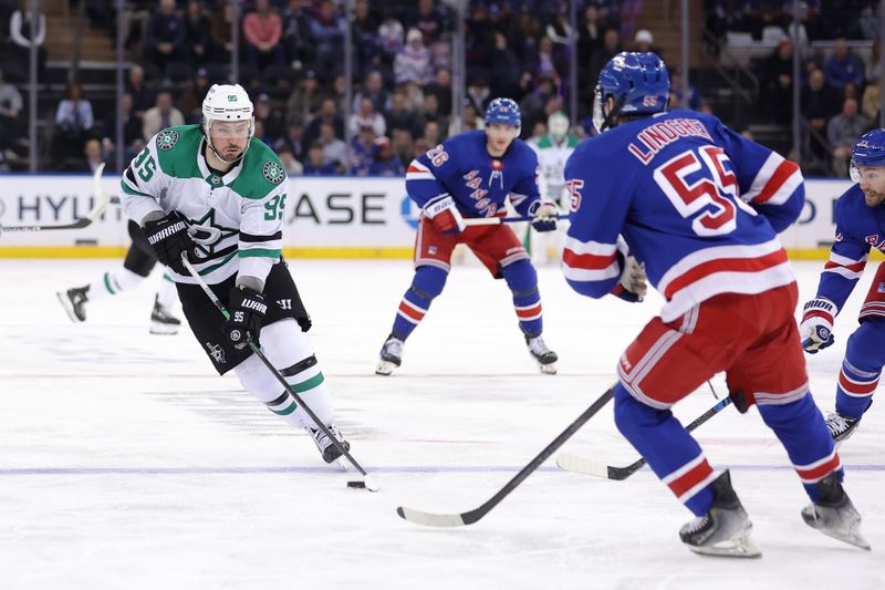 Feb 20, 2024; New York, New York, USA; Dallas Stars center Matt Duchene (95) brings the puck up ice against New York Rangers left wing Jimmy Vesey (26) and defenseman Ryan Lindgren (55) during the third period at Madison Square Garden. Mandatory Credit: Brad Penner-USA TODAY Sports