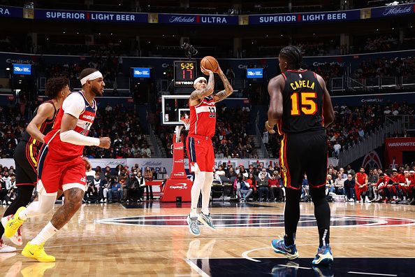 WASHINGTON, DC -? DECEMBER 31: Kyle Kuzma #33 of the Washington Wizards shoots a three point basket during the game against the Atlanta Hawks on December 31, 2023 at Capital One Arena in Washington, DC. NOTE TO USER: User expressly acknowledges and agrees that, by downloading and or using this Photograph, user is consenting to the terms and conditions of the Getty Images License Agreement. Mandatory Copyright Notice: Copyright 2023 NBAE (Photo by Kenny Giarla/NBAE via Getty Images)