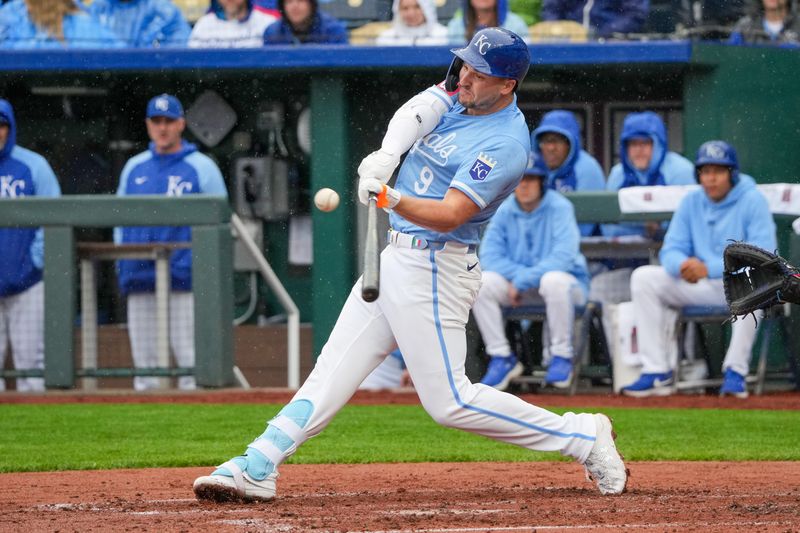 May 5, 2024; Kansas City, Missouri, USA; Kansas City Royals first baseman Vinnie Pasquantino (9) hits a one run double against the Texas Rangers in the third inning at Kauffman Stadium. Mandatory Credit: Denny Medley-USA TODAY Sports