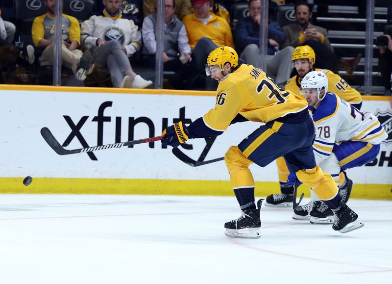 Mar 7, 2024; Nashville, Tennessee, USA; Nashville Predators left wing Cole Smith (36) shoots the puck as Buffalo Sabres defenseman Jacob Bryson (78) closes in on him during their game at Bridgestone Arena. Mandatory Credit: Alan Poizner-USA TODAY Sports