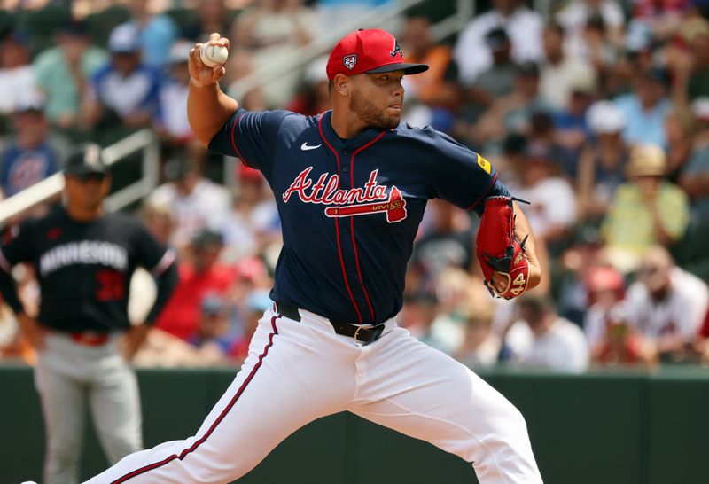 Mar 25, 2024; North Port, Florida, USA; Atlanta Braves relief pitcher Joe Jimenez (77) throws a pitch during the fifth inning against the Minnesota Twins at CoolToday Park. Mandatory Credit: Kim Klement Neitzel-USA TODAY Sports