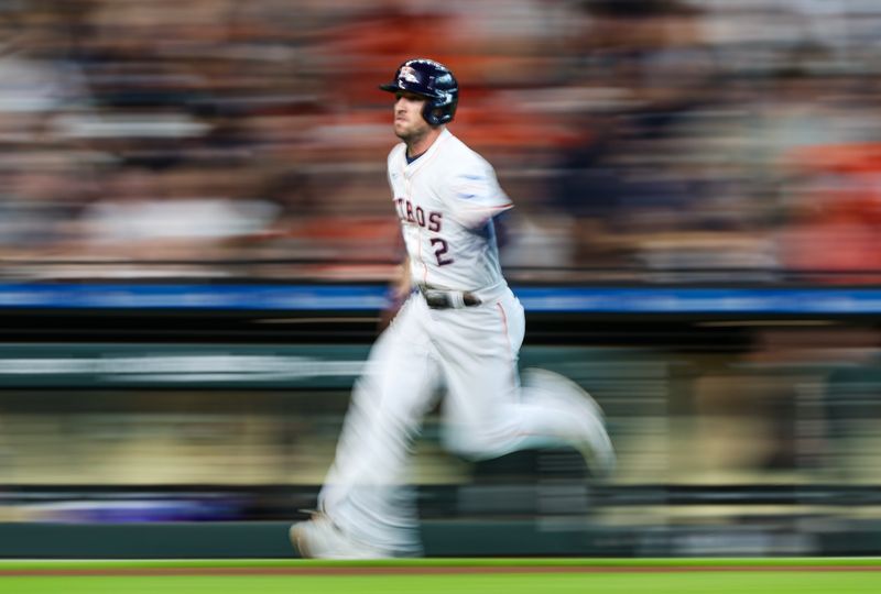 Jun 23, 2024; Houston, Texas, USA;  Houston Astros third baseman Alex Bregman (2) scores on designated hitter Yainer Diaz (21) (not pictured) RBI single against the Baltimore Orioles in the first inning at Minute Maid Park. Mandatory Credit: Thomas Shea-USA TODAY Sports