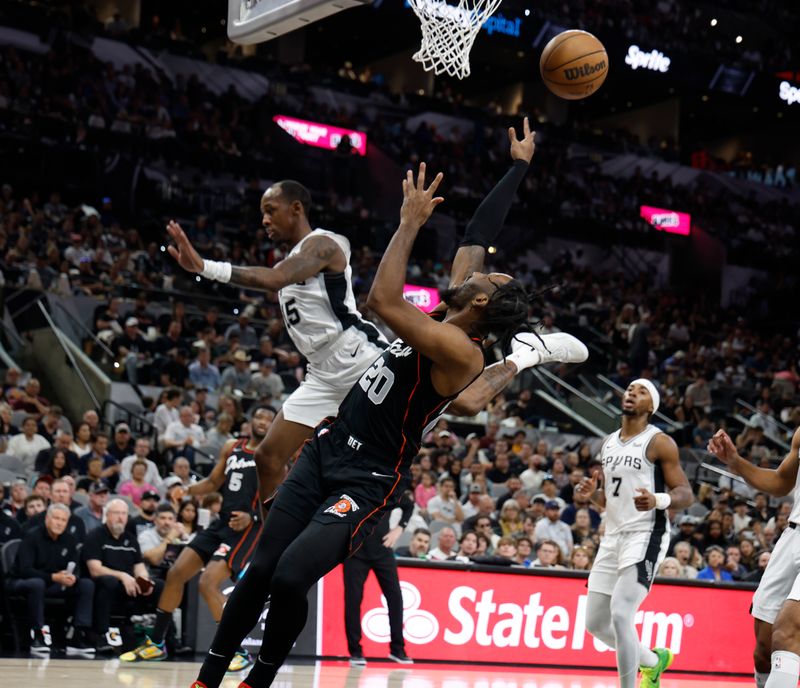 SAN ANTONIO, TX - APRIL 14:  Jaylen Nowell #20 of the Detroit Pistons is fouled by Jamaree Boulea #15 of the San Antonio Spurs in the first half at Frost Bank Center on April 14, 2024 in San Antonio, Texas. NOTE TO USER: User expressly acknowledges and agrees that, by downloading and or using this photograph, User is consenting to terms and conditions of the Getty Images License Agreement. (Photo by Ronald Cortes/Getty Images)