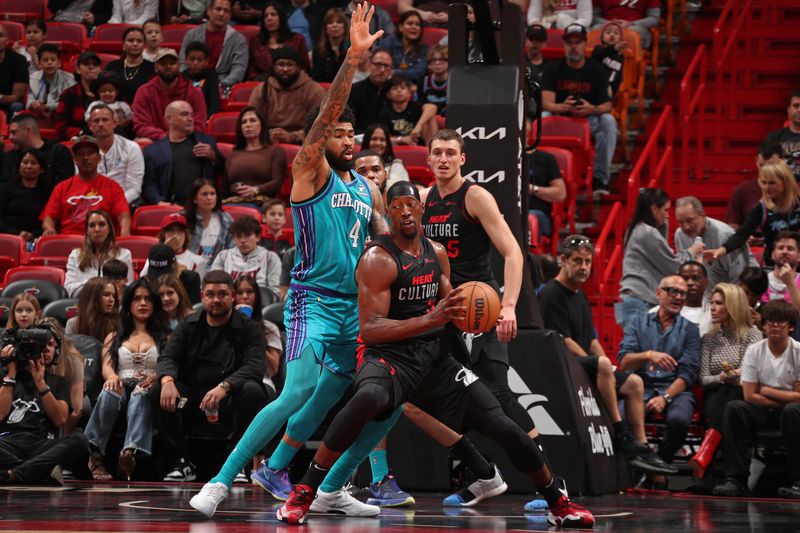 MIAMI, FL - JANUARY 14: Bam Adebayo #13 of the Miami Heat handles the ball during the game against the Charlotte Hornets on January 14, 2024 at Kaseya Center in Miami, Florida. NOTE TO USER: User expressly acknowledges and agrees that, by downloading and or using this Photograph, user is consenting to the terms and conditions of the Getty Images License Agreement. Mandatory Copyright Notice: Copyright 2024 NBAE (Photo by Issac Baldizon/NBAE via Getty Images)