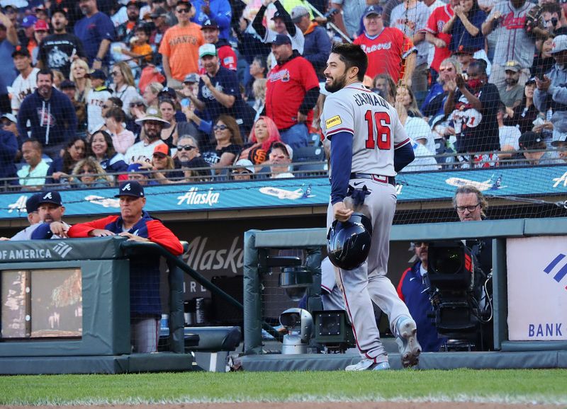 Aug 27, 2023; San Francisco, California, USA; Atlanta Braves catcher Travis d'Arnaud (16) smiles after scoring a run against the San Francisco Giants during the fifth inning at Oracle Park. Mandatory Credit: Kelley L Cox-USA TODAY Sports