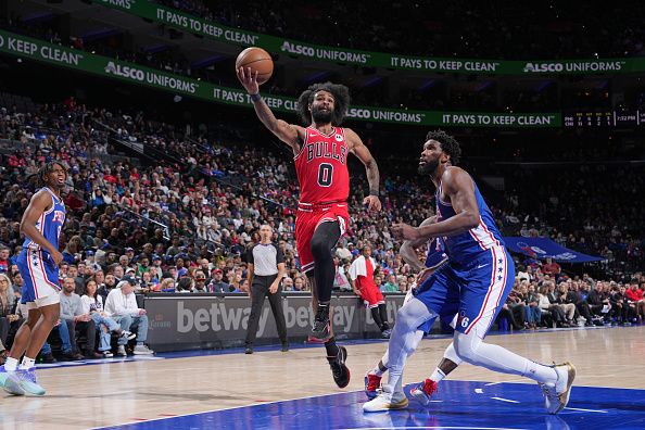 PHILADELPHIA, PA - DECEMBER 18: Coby White #0 of the Chicago Bulls drives to the basket during the game against the Philadelphia 76ers on December 18, 2023 at the Wells Fargo Center in Philadelphia, Pennsylvania NOTE TO USER: User expressly acknowledges and agrees that, by downloading and/or using this Photograph, user is consenting to the terms and conditions of the Getty Images License Agreement. Mandatory Copyright Notice: Copyright 2023 NBAE (Photo by Jesse D. Garrabrant/NBAE via Getty Images)