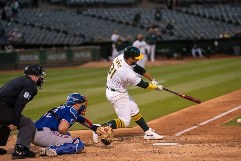 May 6, 2024; Oakland, California, USA; Oakland Athletics second baseman Abraham Toro (31) singles against the Texas Rangers during the sixth inning at Oakland-Alameda County Coliseum. Mandatory Credit: Neville E. Guard-USA TODAY Sports