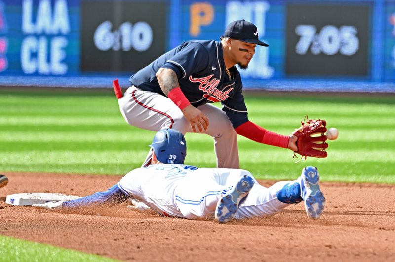 May 13, 2023; Toronto, Ontario, CAN; Toronto Blue Jays center fielder Kevin Kiermaier (39) slides safely into second base with a double as Atlanta Braves shortstop Orlando Arcia (11) takes the throw in the fifth inning at Rogers Centre. Mandatory Credit: Dan Hamilton-USA TODAY Sports