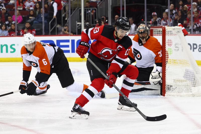 Dec 19, 2023; Newark, New Jersey, USA; New Jersey Devils center Nico Hischier (13) skates with the puck against the Philadelphia Flyers during the second period at Prudential Center. Mandatory Credit: Ed Mulholland-USA TODAY Sports