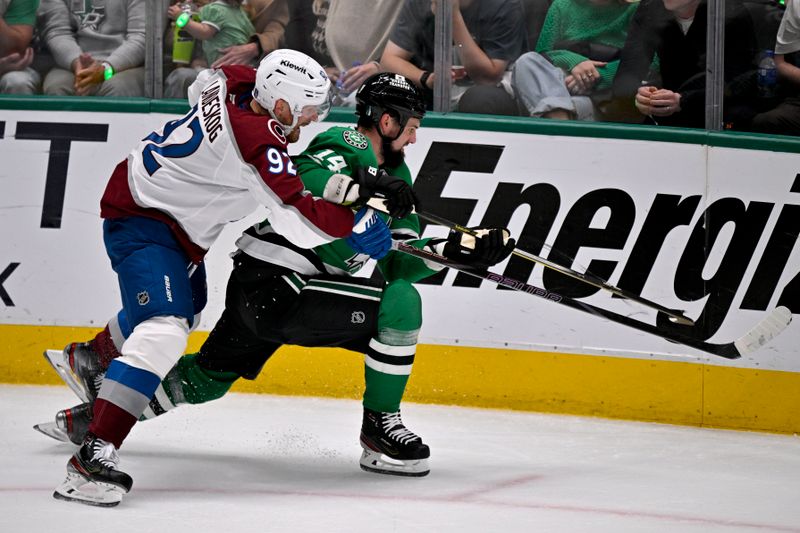 May 3, 2025; Dallas, Texas, USA; Colorado Avalanche left wing Gabriel Landeskog (92) and Dallas Stars left wing Jamie Benn (14) chase the puck during the second period in game seven of the first round of the 2025 Stanley Cup Playoffs at American Airlines Center. Mandatory Credit: Jerome Miron-Imagn Images