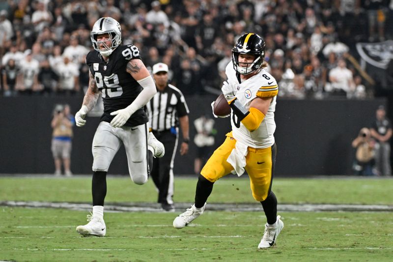 Pittsburgh Steelers quarterback Kenny Pickett makes a long run which was called back due to a penalty during the first half of an NFL football game against the Las Vegas Raiders Sunday, Sept. 24, 2023, in Las Vegas. (AP Photo/David Becker)