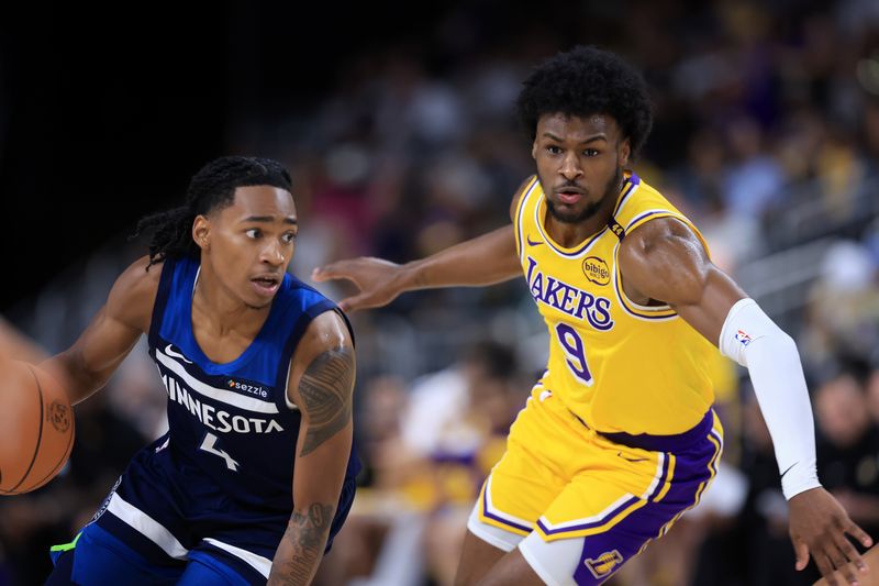 PALM SPRINGS, CALIFORNIA - OCTOBER 04: Bronny James #9 of the Los Angeles Lakers defends against Nickeil Alexander-Walker #9 of the Minnesota Timberwolves during the second half of a game at Acrisure Arena on October 04, 2024 in Palm Springs, California.  (Photo by Sean M. Haffey/Getty Images)