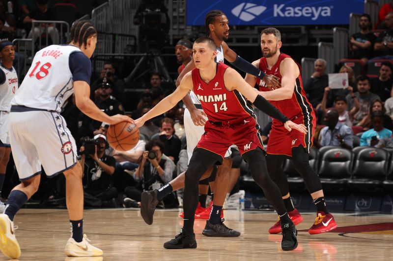 MIAMI, FL - MARCH 3: Tyler Herro #14 of the Miami Heat plays defense during the game against the Washington Wizards on March 3, 2025 at Kaseya Center in Miami, Florida. NOTE TO USER: User expressly acknowledges and agrees that, by downloading and or using this Photograph, user is consenting to the terms and conditions of the Getty Images License Agreement. Mandatory Copyright Notice: Copyright 2025 NBAE (Photo by Issac Baldizon/NBAE via Getty Images)