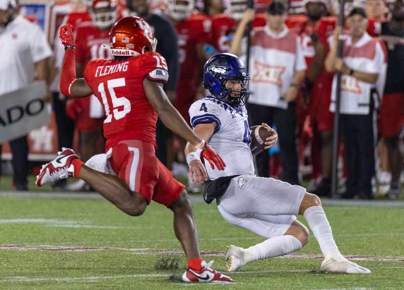 Sep 16, 2023; Houston, Texas, USA; TCU Horned Frogs quarterback Chandler Morris (4) slides infant of Houston Cougars defensive back Malik Fleming (15) in the second half at TDECU Stadium. Mandatory Credit: Thomas Shea-USA TODAY Sports