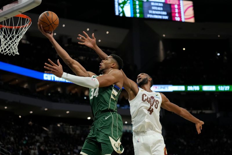 MILWAUKEE, WISCONSIN - NOVEMBER 02: Giannis Antetokounmpo #34 of the Milwaukee Bucks shoots the ball against Evan Mobley #4 of the Cleveland Cavaliers during the third quarter of a game at Fiserv Forum on November 02, 2024 in Milwaukee, Wisconsin. NOTE TO USER: User expressly acknowledges and agrees that, by downloading and or using this photograph, User is consenting to the terms and conditions of the Getty Images License Agreement. (Photo by Patrick McDermott/Getty Images)