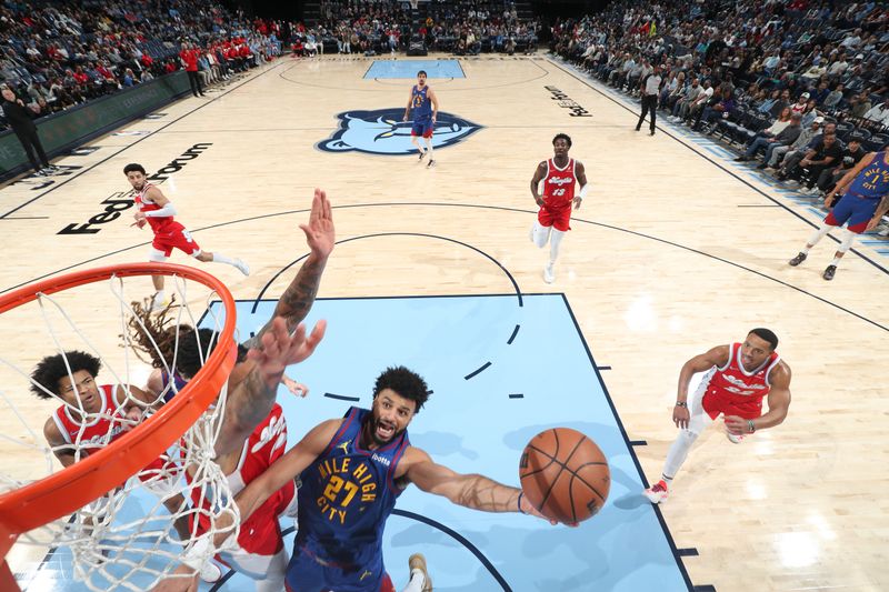 MEMPHIS, TN - NOVEMBER 17: Jamal Murray #27 of the Denver Nuggets shoots the ball during the game against the Memphis Grizzlies on November 17, 2024 at FedExForum in Memphis, Tennessee. NOTE TO USER: User expressly acknowledges and agrees that, by downloading and or using this photograph, User is consenting to the terms and conditions of the Getty Images License Agreement. Mandatory Copyright Notice: Copyright 2024 NBAE (Photo by Joe Murphy/NBAE via Getty Images)