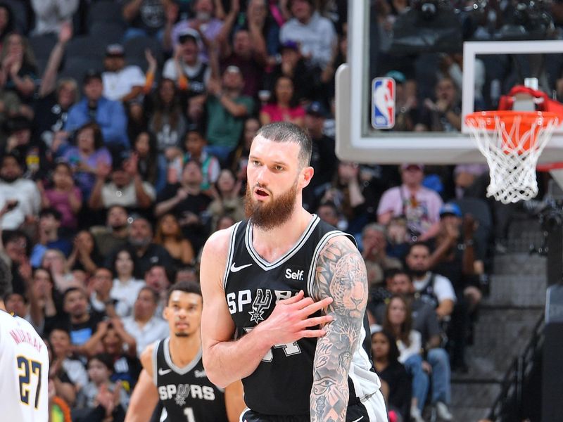 SAN ANTONIO, TX - APRIL 12:  Sandro Mamukelashvili #54 of the San Antonio Spurs  celebrates during the game on April 12, 2024 at the Frost Bank Center in San Antonio, Texas. NOTE TO USER: User expressly acknowledges and agrees that, by downloading and or using this photograph, user is consenting to the terms and conditions of the Getty Images License Agreement. Mandatory Copyright Notice: Copyright 2024 NBAE (Photos by Michael Gonzales/NBAE via Getty Images)