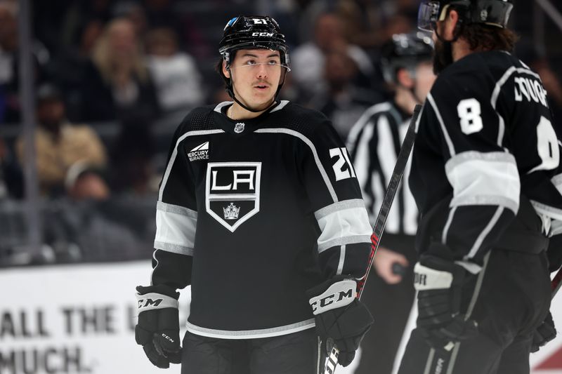 Nov 11, 2023; Los Angeles, California, USA;  Los Angeles Kings defenseman Jordan Spence (21) talks to defenseman Drew Doughty (8) during the third period at Crypto.com Arena. Mandatory Credit: Kiyoshi Mio-USA TODAY Sports