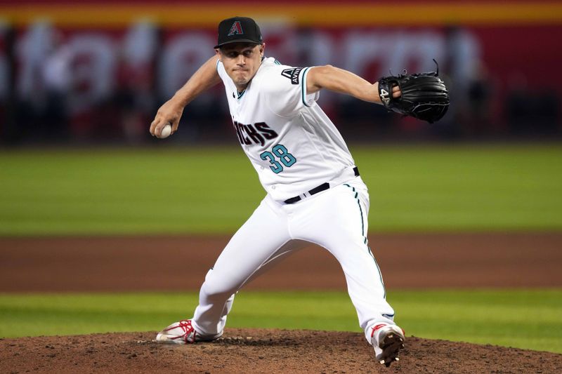 Sep 4, 2023; Phoenix, Arizona, USA; Arizona Diamondbacks relief pitcher Paul Sewald (38) pitches against the Colorado Rockies during the ninth inning at Chase Field. Mandatory Credit: Joe Camporeale-USA TODAY Sports