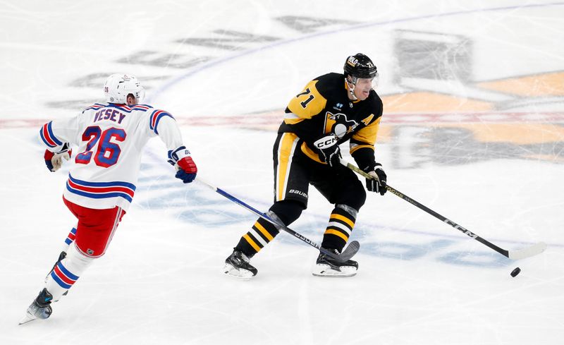 Nov 22, 2023; Pittsburgh, Pennsylvania, USA; Pittsburgh Penguins center Evgeni Malkin (71) moves  the puck against New York Rangers left wing Jimmy Vesey (26) during the third period at PPG Paints Arena. The Rangers won 1-0. Mandatory Credit: Charles LeClaire-USA TODAY Sports