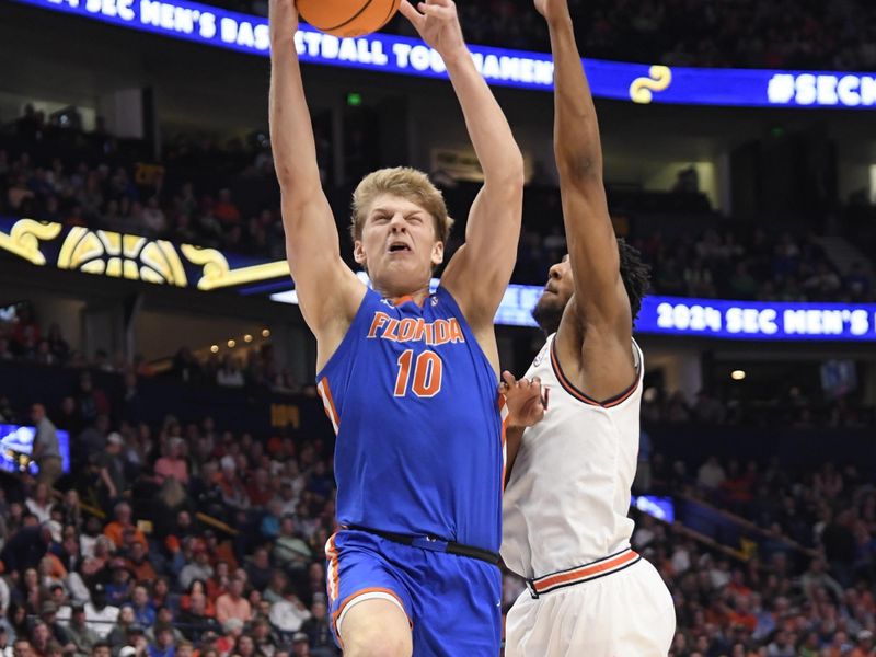 Mar 17, 2024; Nashville, TN, USA; Florida Gators forward Thomas Haugh (10) shoots against Auburn Tigers guard Chaney Johnson (31) in the first half in the SEC Tournament championship game at Bridgestone Arena. Mandatory Credit: Steve Roberts-USA TODAY Sports